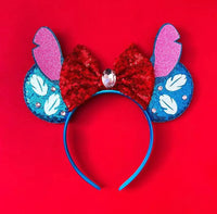 oreilles Stitch Bleues à Nœud Rouge et Bijou